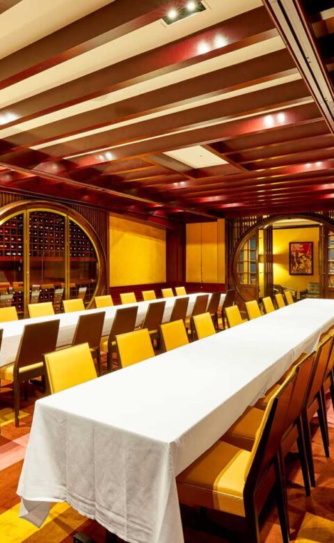 boardroom set up with two long parallel tables