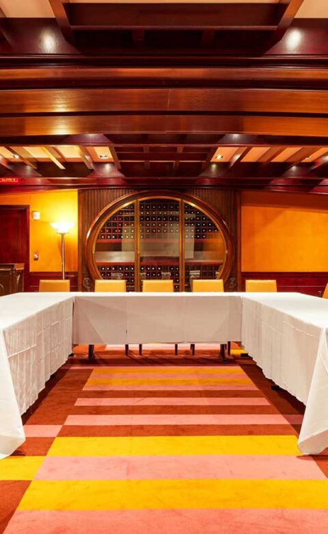 boardroom with chairs around a u-shape setup