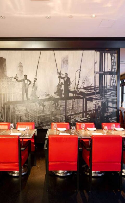 tables in a bar set for drinks and a meal