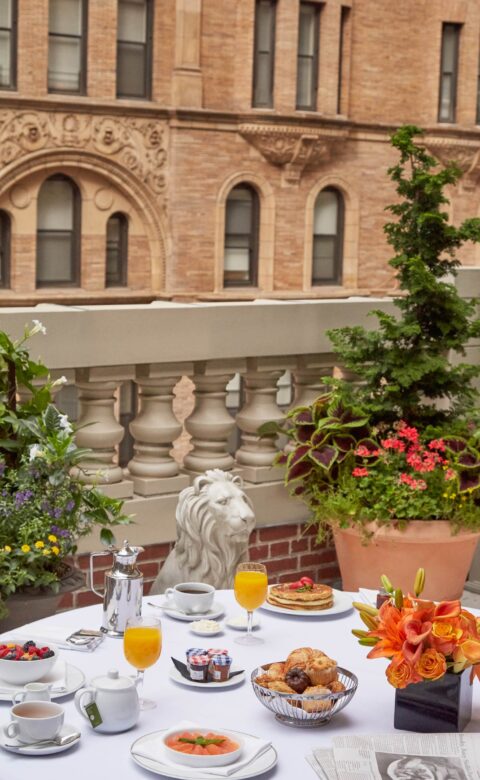 A table on a terrace with breakfast served